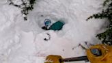 Terrifying video showing man buried headfirst in snow released as 'whiteout' blizzard bears down on US