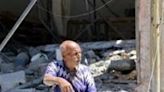 A Palestinian man in front of a destroyed building in north Gaza's Jabalia refugee camp