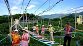 A man fell to his death and a 10-year-old boy slipped from his safety harness while crossing China's famous bridge obstacle courses, igniting an uproar over safety concerns