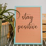 Motivational messages or quotes printed on a decorative sign, providing a daily dose of positivity and encouragement.