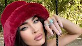 Megan Fox Shows off Her "Jungle Fever" Side With White XL White Feathered Extensions