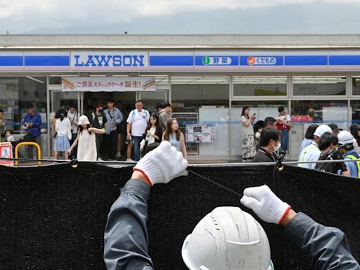 Swarmed with tourists, Japan town blocks off viral view of Mt. Fuji