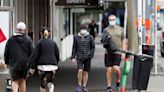 New Zealand announces free masks, tests as health system struggles with COVID