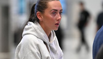 Love Island's Jess White puts on a brave face as she returns to the UK