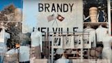 ‘Brandy Hellville & the Cult of Fast Fashion’ Trailer Hints at the Man Behind the Curtain | Video