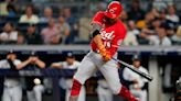 Votto delivers, Reds surprise Yanks 7-6 in 10 to win series