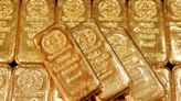 Gold nudges lower as Fed members bat for higher interest rates