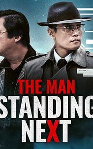 The Man Standing Next