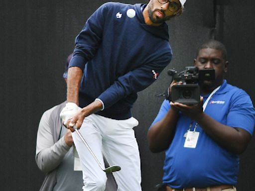 Akshay Bhatia shares the lead in Detroit after his golf ball finds a fairway drain on the 17th