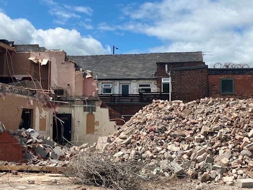 Clubbers at iconic Greater Manchester venue grab souvenirs from demolition site as it's pulled down