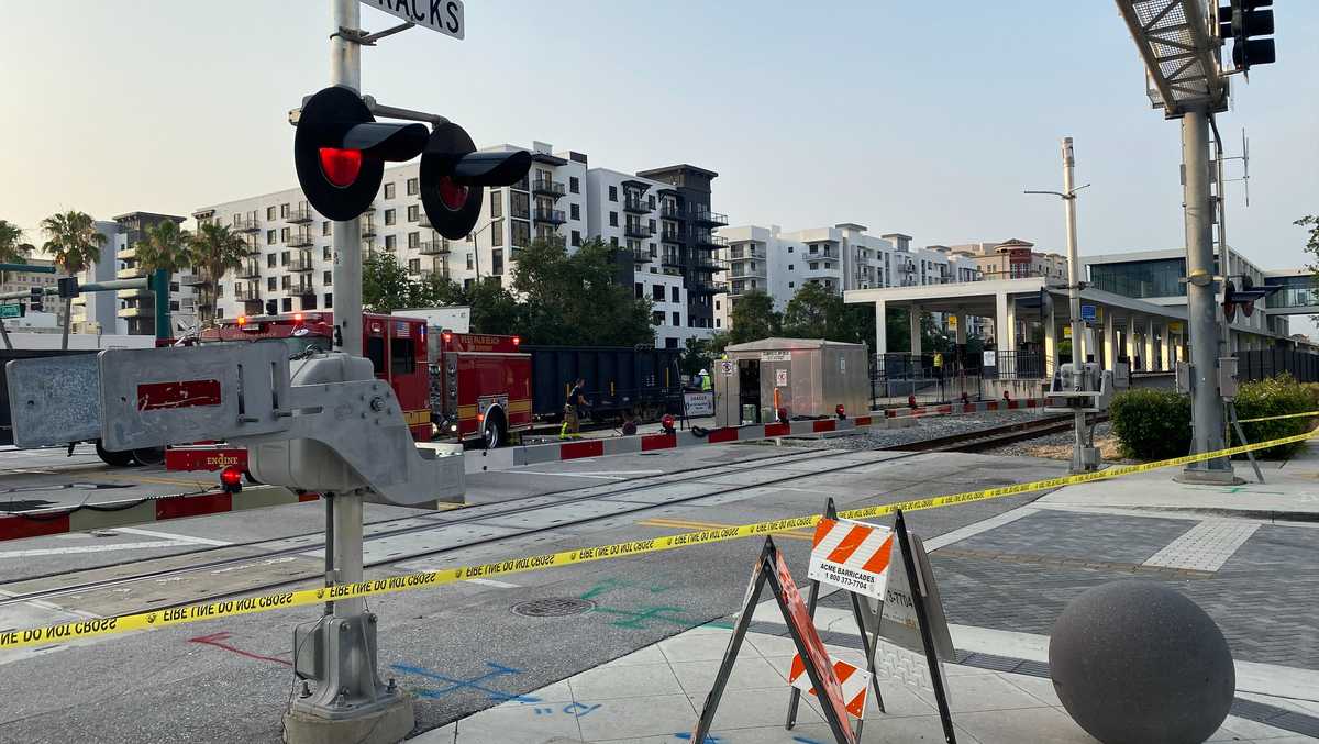 Cargo train hits abandoned car on tracks, closes streets in downtown West Palm Beach