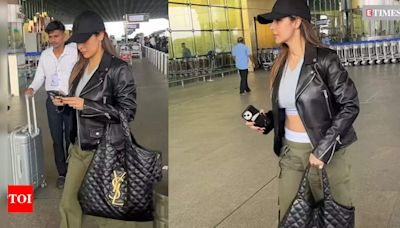 Malaika Arora's bag of whopping cost price steals the show as she makes an appearance in the city | Hindi Movie News - Times of India