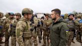 Ukraine war - live: Zelensky praises troops on visit to newly liberated city