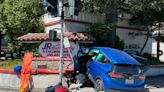 San Rafael car crashes in front of collision repair shop