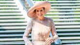 Queen Maxima turns heads in yet another striking hat and cream dress