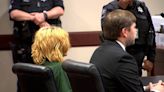 Georgia high school shooting suspect and his father make first court appearances, do not enter pleas