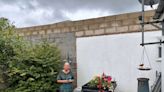 Neighbours row over ‘prison’ wall which ‘blocks out sunlight’