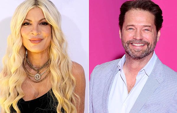 Tori Spelling says she chipped her front tooth during makeout session with Jason Priestley in an elevator