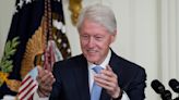 Bill Clinton back at White House to push paid family leave