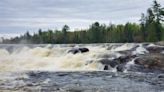 Rescue efforts for canoeists who went over Minnesota waterfall continue; Guard deployed