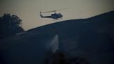 Firefighting helicopters collide in midair, killing 3