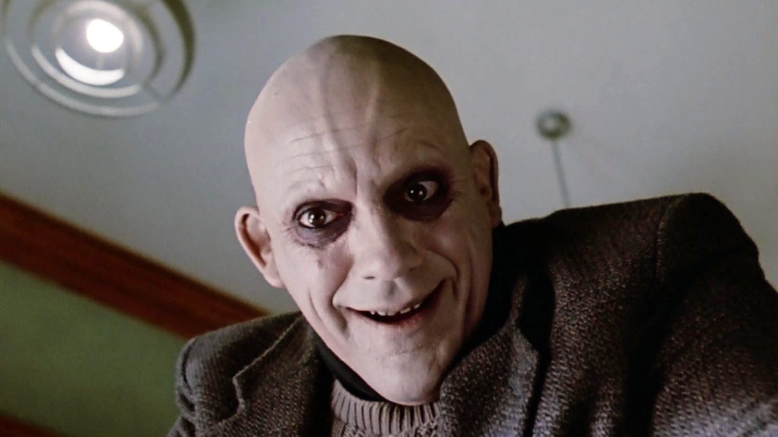 Why Christopher Lloyd Thought He Was Being Replaced In The Addams Family - SlashFilm