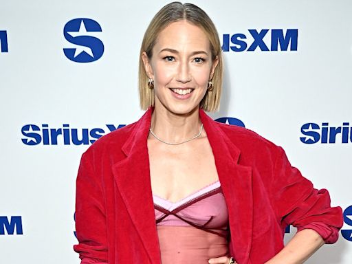 Carrie Coon bares belly in sheer tank top beneath red pantsuit in NYC