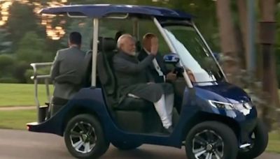 Vladimir Putin and Indian PM Narendra Modi ride in golf cart during tour of president’s residence