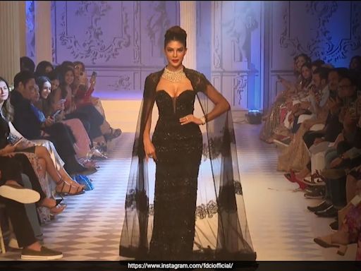 ICW 2024: Jacqueliene Fernandez Dazzled In A Shimmering Black Strapless Gown And Lace Cape On The Rose Room Runway