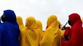 Women await the arrival of Mahamat Idriss Deby Itno, Chad's transitional president and candidate for the presidential election at Moundou