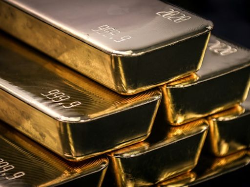 Europe stocks dented by UK inflation; gold hits new peak