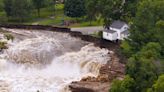 Part of a Minnesota home has plunged into the Blue Earth River as deadly Midwest flooding threatens the nearby Rapidan Dam
