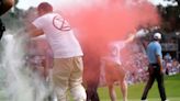 Climate protesters tackled after storming 18th green at PGA Tour event