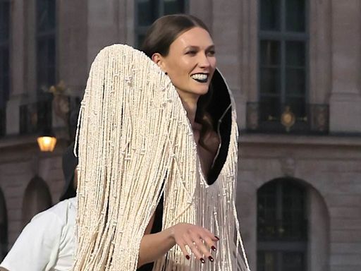 Karlie Kloss giggles on the runway at Vogue World Paris