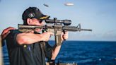 US Navy mocked for image of captain firing gun with back-to-front scope