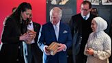 King tackles puzzle box during visit to one of London’s architectural treasures