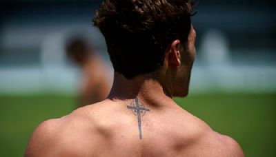 At the Olympics, athletes show guts, glory – and a lot of ink, including tattoos that profess their faith