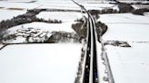 Storm Larisa batters parts of UK with blizzards as travel warnings issued