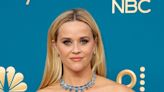 Reese Witherspoon Dresses Her Dog in a Christmas Sweater on IG—But Minnie Seems Over It