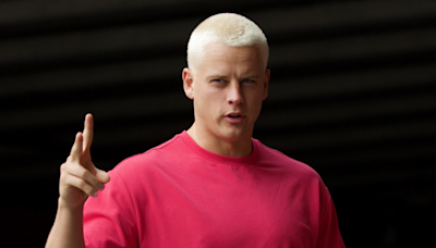 Joe Burrow reports to training camp with new buzz haircut