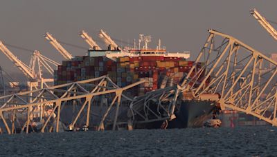 Baltimore Bridge videos show explosion as officials work to free ship