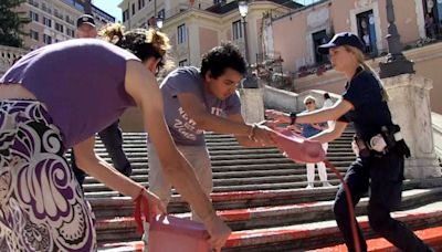 Activists pour paint down Rome’s Spanish Steps in outrage over femicide in Italy