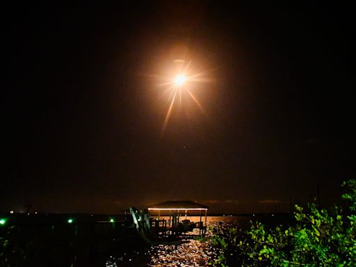 SpaceX Falcon 9 rocket flashes fiery multicolored exhaust across nighttime sky Thursday