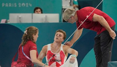 Olympics-Gymnastics-Canada's Dolci gets do over on bar after equipment malfunction