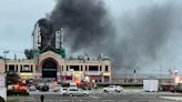 Black smoke can be seen billowing out of a structure on the Atlantic City boardwalk