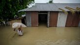 Floods and landslides triggered by heavy rains in India's northeast kill at least 16 people