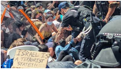 Riot police drag away protesters at University of Texas as Gaza tensions flare