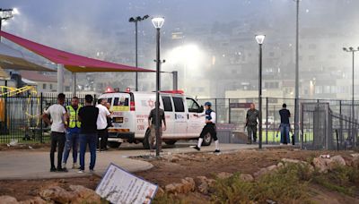 Israeli authorities say at least 11 people killed in rocket attack on football pitch in Israeli-occupied Golan Heights