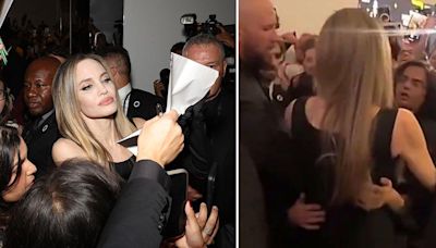 The shocking moment Angelina Jolie is grabbed by rabid fan in chaotic scrum