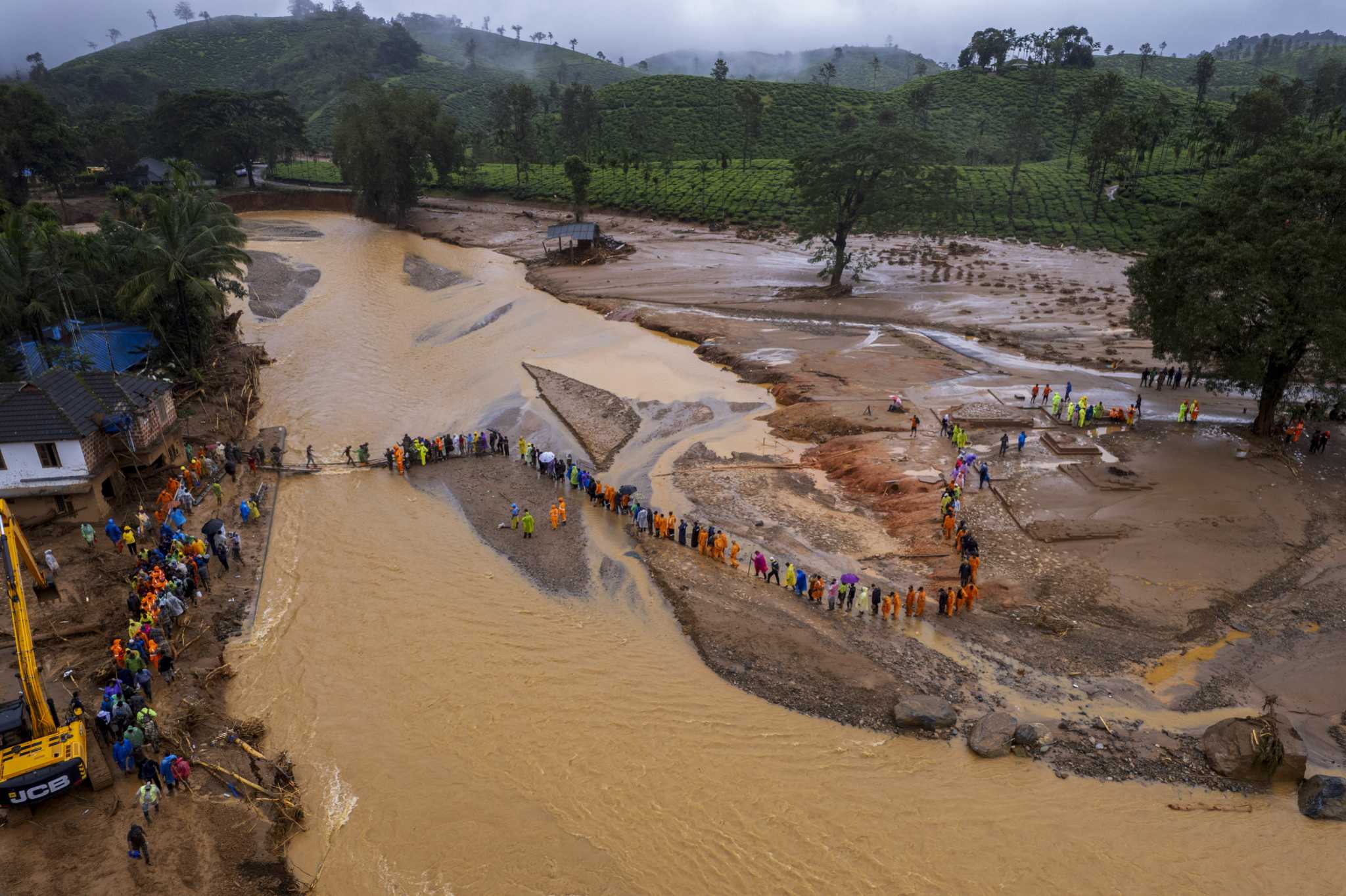 Rescuers search through mud and debris as deaths rise to 166 in landslides in southern India